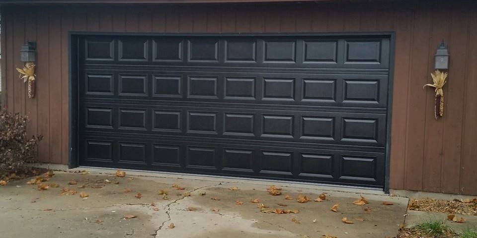 Garage door repaired and repainted Powder coat black - Glenn Brothers - Springfield, IL
